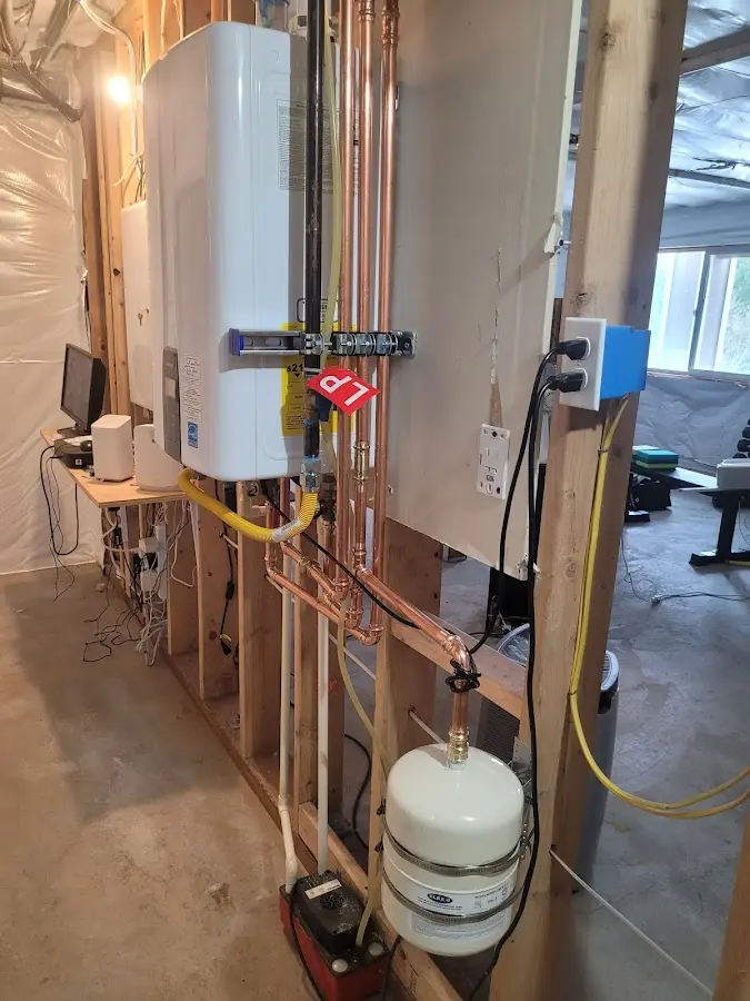 Licensed plumber repairing a kitchen sink in Linden