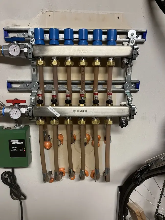 Plumber performing Water Heater Repair at a residential property in Linden